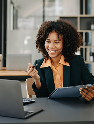 confident woman typing laptop
